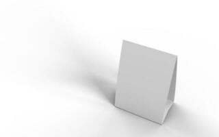 Haut vers le bas vue de une blanc papier carton table tente sur une blanc arrière-plan, pour maquette et illustrations. 3d rendre. photo