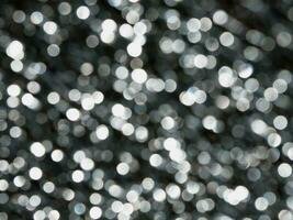 rond lumineux perles, bokeh sur foncé noir Contexte photo