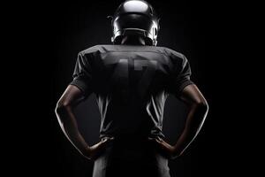 vue de le retour de américain Football joueur isolé sur noir Contexte illustration génératif ai photo