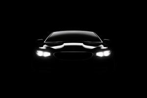 de face vue foncé silhouette de une moderne luxe noir voiture isolé sur noir Contexte. ai généré photo