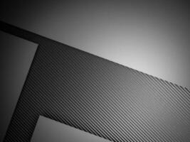 abstrait pente métal Contexte foncé avec carbone fibre texture photo