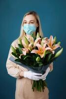 portrait de Jeune femme portant masque et en portant magnifique fleurs de lys bouquet, génératif ai. photo