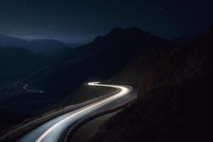 nuit conduire sur une courbée Montagne route avec longue exposition lumière les sentiers ai généré photo