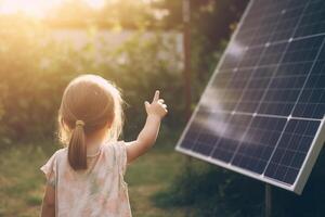 peu enfant permanent par solaire panneau avec vert bokeh Contexte et Soleil des rayons ai généré photo