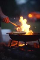 grésillant chaud fermer de ouvert flamme un barbecue à camping site ai généré photo