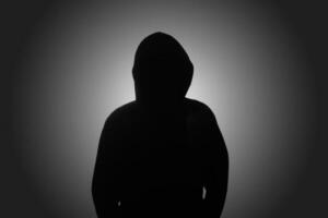 Indonesia, 21122021 - a silhouette of a man in a black hoodie 4909878 Stock  Photo at Vecteezy