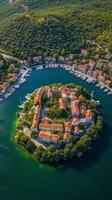 un aérien vue de de skradin historique centre, avec ses enroulement des rues et coloré bâtiments niché parmi le luxuriant verdure. ai génératif photo