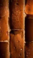 Fond de texture de mur de brique rouge vieux vertical close-up photo
