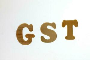 gst des biens et un service impôt alphabet sur blanc Contexte photo