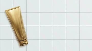 Haut voir. d'or Plastique cosmétique tube pour crème ou gel maquette sur tuile Contexte photo