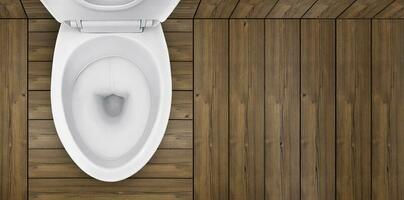Haut voir. de toilette bol dans salle de bains avec en bois sol photo