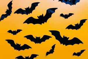 plat allonger Halloween. chauves-souris modèle sur Orange Contexte photo