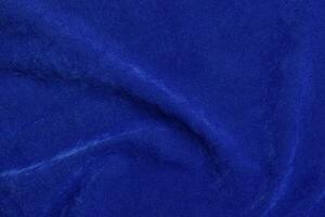 bleu velours en tissu texture utilisé comme Contexte. bleu en tissu Contexte de doux et lisse textile matériel. là est espace pour texte. photo