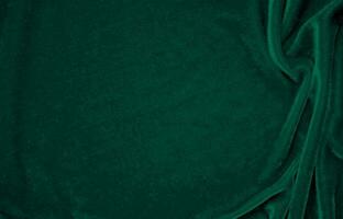 vert velours en tissu texture utilisé comme Contexte. paon Couleur panne en tissu Contexte de doux et lisse textile matériel. écrasé velours .luxe émeraude Ton pour soie. photo