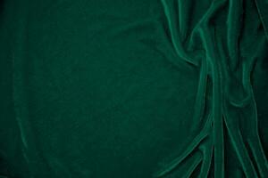 vert velours en tissu texture utilisé comme Contexte. paon Couleur panne en tissu Contexte de doux et lisse textile matériel. écrasé velours .luxe émeraude Ton pour soie. photo