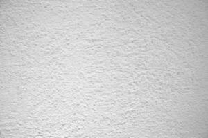 surface de le blanc pierre texture rugueux, gris-blanc Ton. utilisation cette pour fond d'écran ou Contexte image. là est une Vide espace pour texte ciment mur. photo