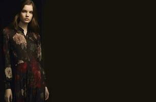 Jeune fille dans une robe avec une Couleur impression sur une noir Contexte. génératif ai photo