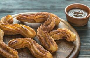 Churros avec sauce au chocolat photo