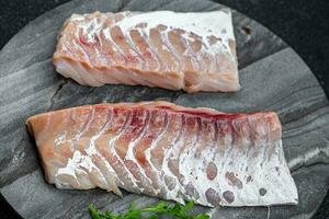 filet de blanc poisson sans pour autant peau et des os Frais Fruit de mer en bonne santé repas nourriture casse-croûte sur le table copie espace nourriture Contexte rustique Haut vue pescatarian régime photo