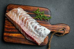 filet de blanc poisson sans pour autant peau et des os Frais Fruit de mer en bonne santé repas nourriture casse-croûte sur le table copie espace nourriture Contexte rustique Haut vue pescatarian régime photo