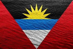 drapeau de antigua et Barbuda sur une texturé Contexte. concept collage. photo