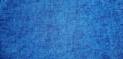 lumière bleu Couleur abstrait denim veste, ancien denim jeans tissu et en tissu proche en haut macro photo pour Contexte