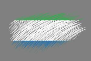 3d drapeau de sierra leone sur ancien style brosse Contexte. photo