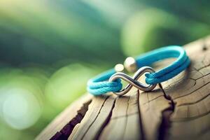 une proche en haut photographier de une paire bleu bracelet formant un infini symbole sur une rustique bois avec bokeh Contexte photo