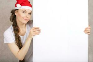 Jeune Dame dans Père Noël claus chapeau photo