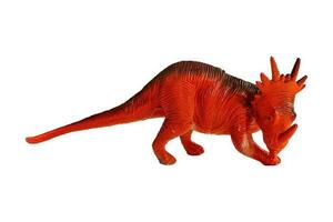 petit jouet dinosaure, tricératops, isolé sur Vide Contexte. photo