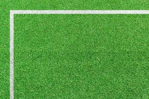 herbe football champ avec blanc modèle lignes. Haut vue sport Contexte. photo