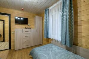 intérieur de en bois éco chambre dans studio appartements, hôtel ou propriété photo