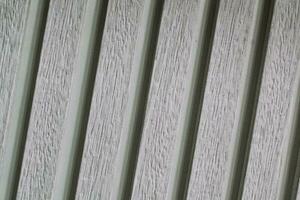 texture de en bois traverses. mur de coloré planches. clôture. intérieur lattes Contexte. le structure de le planches. architecture panneaux photo