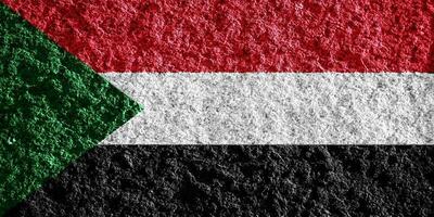 drapeau de république de Soudan sur une texturé Contexte. concept collage. photo