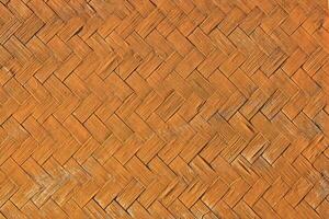 Contexte image de une maison mur fabriqué de tissé bambou photo