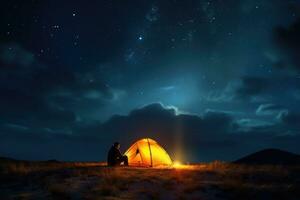 illuminé camp tente en dessous de une vue de le montagnes et une étoilé ciel. génératif ai photo