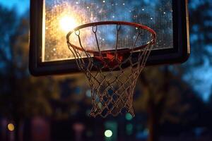 proche - en haut vue de le basketball cerceau à un vide Urbain Extérieur tribunal à nuit. génératif ai photo