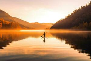 une serein coup de une paddleboarder glissement à travers une calme Lac à lever du soleil. génératif ai photo