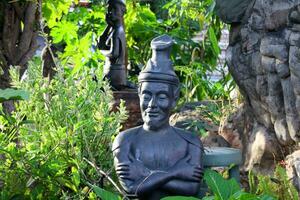 thaïlandais ermite originaire de statue dans élongation posture ou thaïlandais yoga pour soi soins de santé dans wat Pho, Thaïlande. photo