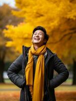 photo de émotif dynamique pose asiatique homme dans l'automne ai génératif