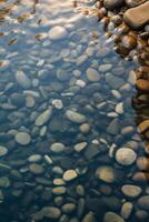 ai génératif petit des pierres dans le rivière clair l'eau transparent fermer ondulations vagues photo