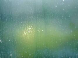 proche en haut l'eau pluie laissez tomber tache sur fenêtre verre abstrait Contexte image, ai génératif photo