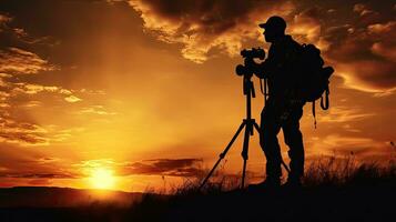 silhouette de photographe à le coucher du soleil capturé dans une photo