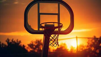 idéal fond d'écran avec le coucher du soleil silhouette dans basketball cerceau photo