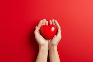 doux femelle mains tenir une rouge cœur sur une rouge Contexte. la Saint-Valentin journée ai généré photo