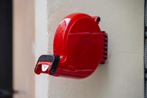 éliminateur de file d'attente de magasin de couleur rouge fixé au mur photo