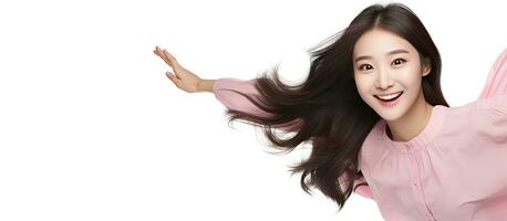 souriant asiatique fille flottant dans milieu air montrer du doigt à vide espace avec une détendu pose photo