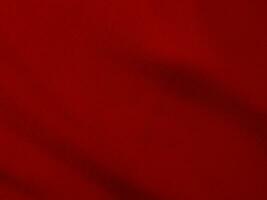 rouge soie en tissu texture utilisé comme Contexte. rouge panne en tissu Contexte de doux et lisse textile matériel. écrasé velours .luxe écarlate pour velours. photo