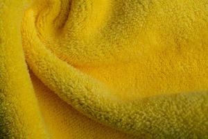 Fond de texture de tissu jaune, résumé, texture de gros plan de tissu photo