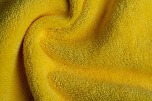 Fond de texture de tissu jaune, résumé, texture de gros plan de tissu photo
